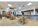 Restaurant featuring tables and chairs inside the condominium complex at 6165 Carrier Dr # 2605, Orlando, FL 32819
