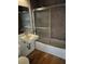 Cozy bathroom featuring a walk-in shower, mosaic tile, and a single-sink vanity at 62 W Colonial Dr # 302, Orlando, FL 32801