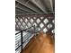 Second floor landing featuring hardwood floors, black metal railing and unique wood accent wall at 62 W Colonial Dr # 302, Orlando, FL 32801