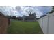 Large backyard with lush green grass and a privacy fence at 651 Oak Hollow Way, Altamonte Springs, FL 32714