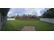 Expansive backyard featuring a brick wall and privacy fence, offering a secluded outdoor space at 651 Oak Hollow Way, Altamonte Springs, FL 32714
