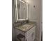 Bathroom vanity with granite countertop and modern, lighted mirror at 651 Oak Hollow Way, Altamonte Springs, FL 32714