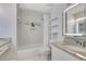 Bathroom with granite vanity, shower and white tiled tub surround at 651 Oak Hollow Way, Altamonte Springs, FL 32714