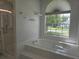 Bathroom with a large soaking tub and walk-in shower at 651 Oak Hollow Way, Altamonte Springs, FL 32714