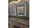 Bathroom vanity with granite countertop and double, lighted mirror cabinets at 651 Oak Hollow Way, Altamonte Springs, FL 32714