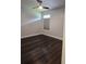 Neat bedroom featuring hardwood-look floors, a ceiling fan, and a large, bright window at 651 Oak Hollow Way, Altamonte Springs, FL 32714