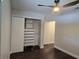 Spacious bedroom with hard-wood-look floors and a closet; a ceiling fan provides air circulation at 651 Oak Hollow Way, Altamonte Springs, FL 32714