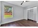 Bedroom with hardwood floors, ceiling fan, and a closet with built-in shelves at 651 Oak Hollow Way, Altamonte Springs, FL 32714