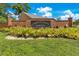 Landscaped brick entrance sign reading 'Country Creek Estate' with colorful shrubbery in front at 651 Oak Hollow Way, Altamonte Springs, FL 32714