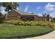 Welcome to Country Creek Estates, where a brick wall and manicured hedges exude serene community charm at 651 Oak Hollow Way, Altamonte Springs, FL 32714