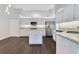 Bright kitchen features granite counters, stainless appliances, and a center island at 651 Oak Hollow Way, Altamonte Springs, FL 32714