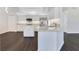 Open kitchen with white cabinets, granite counters, and stainless steel appliances at 651 Oak Hollow Way, Altamonte Springs, FL 32714