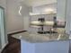 Modern kitchen featuring granite countertops and stainless steel appliances at 651 Oak Hollow Way, Altamonte Springs, FL 32714