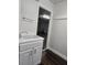 Laundry sink with white cabinets and updated flooring, near the garage at 651 Oak Hollow Way, Altamonte Springs, FL 32714