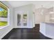 Living area with bright lighting, hardwood floors, and backyard view at 651 Oak Hollow Way, Altamonte Springs, FL 32714