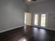 Spacious living room with hardwood floors and french doors at 651 Oak Hollow Way, Altamonte Springs, FL 32714
