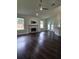 Open living space with stone fireplace, vaulted ceilings, and access to screened patio at 651 Oak Hollow Way, Altamonte Springs, FL 32714