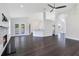 Living room boasting hardwood floors, fireplace, and open layout to kitchen at 651 Oak Hollow Way, Altamonte Springs, FL 32714