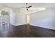 Open living room with archway, high ceilings, wood floors, ceiling fan, and natural light at 651 Oak Hollow Way, Altamonte Springs, FL 32714