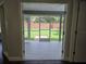 View through glass doors to tiled, screened-in patio at 651 Oak Hollow Way, Altamonte Springs, FL 32714
