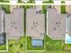 Aerial shot of a home with a large backyard and a screened-in pool with floats at 6947 Cucamelon Ct, Windermere, FL 34786
