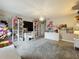 Bright bedroom with a chandelier, a large window, and plenty of space for studying and relaxing at 6947 Cucamelon Ct, Windermere, FL 34786