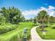 Beautiful community park featuring lush landscaping, walking paths, and a dedicated pet waste station at 6947 Cucamelon Ct, Windermere, FL 34786