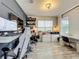 Modern home office with custom shelving, a large computer setup, and a comfortable ergonomic chair at 6947 Cucamelon Ct, Windermere, FL 34786