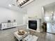Comfortable living room with a modern fireplace, tasteful decor, and an open layout for entertaining at 6947 Cucamelon Ct, Windermere, FL 34786