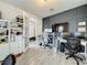 Bright office space with french doors, custom cabinetry, and dual workstations for a productive environment at 6947 Cucamelon Ct, Windermere, FL 34786