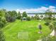Well-maintained neighborhood park with lush greenery, a soccer net, and picnic pavilion, all overlooking the tranquil lake at 6947 Cucamelon Ct, Windermere, FL 34786