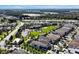 Aerial view of homes and community amenities including playgrounds, parks and swimming pools at 7616 Cabana Ct # 301, Reunion, FL 34747