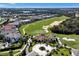 Aerial view of golf course, club house and surrounding area at 7616 Cabana Ct # 301, Reunion, FL 34747