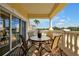 Relaxing balcony provides a comfortable spot to enjoy views, featuring outdoor seating and architectural column supports at 7616 Cabana Ct # 301, Reunion, FL 34747
