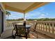 Enjoy outdoor dining on this balcony, complemented by architectural columns and picturesque views of the surrounding landscape at 7616 Cabana Ct # 301, Reunion, FL 34747
