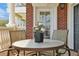 Charming balcony with seating, featuring a table and chairs, offers views and a relaxing space for outdoor enjoyment at 7616 Cabana Ct # 301, Reunion, FL 34747