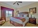 Inviting bedroom showcases a comfortable bed with accent pillows, complemented by matching nightstands and warm lighting at 7616 Cabana Ct # 301, Reunion, FL 34747