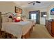 Bedroom features two twin beds, a ceiling fan, decorative art, and a dresser at 7616 Cabana Ct # 301, Reunion, FL 34747