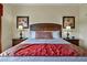 Cozy bedroom features a luxurious bed with decorative pillows, flanked by elegant lamps on matching bedside tables at 7616 Cabana Ct # 301, Reunion, FL 34747