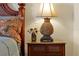 Pineapple lamp with floral arrangement sitting on a wooden nightstand at 7616 Cabana Ct # 301, Reunion, FL 34747