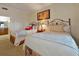Bedroom with twin beds, ceiling fan, closet and en suite bathroom with granite vanity at 7616 Cabana Ct # 301, Reunion, FL 34747