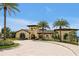 Stately Nicklaus Clubhouse with lush landscaping and elegant entry, perfect for community gatherings at 7616 Cabana Ct # 301, Reunion, FL 34747