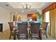 Elegant dining area featuring chandelier lighting and seamless access to the kitchen at 7616 Cabana Ct # 301, Reunion, FL 34747