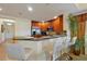 Eat-in kitchen featuring granite countertops, stainless appliances, and barstool seating at 7616 Cabana Ct # 301, Reunion, FL 34747