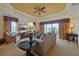 Inviting living room with tray ceiling, comfortable seating, and views of the outdoors at 7616 Cabana Ct # 301, Reunion, FL 34747