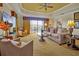 Comfortable living room with plush seating, natural light, and access to outdoor balcony at 7616 Cabana Ct # 301, Reunion, FL 34747