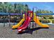 Colorful community playground featuring slides and climbing structures for Gathering fun at 7616 Cabana Ct # 301, Reunion, FL 34747