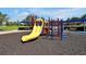 Community playground with shade covering, ladders, and slides provides a safe and fun environment at 7616 Cabana Ct # 301, Reunion, FL 34747