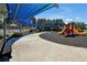 Community playground featuring colorful slides, benches, and a covered area for year-round fun at 7616 Cabana Ct # 301, Reunion, FL 34747
