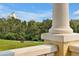 Relaxing view with golf cart of a lush green golf course and beautiful clubhouse at 7616 Cabana Ct # 301, Reunion, FL 34747
